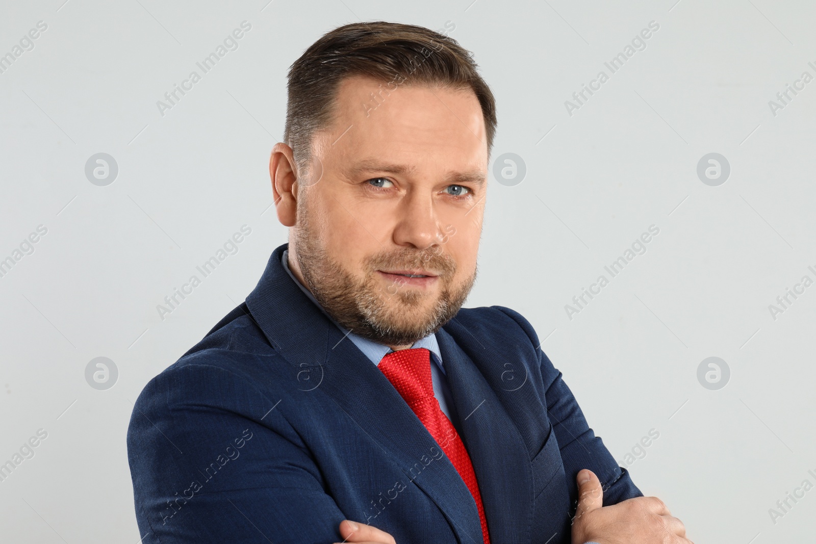 Photo of Portrait of happy mature man on light grey background