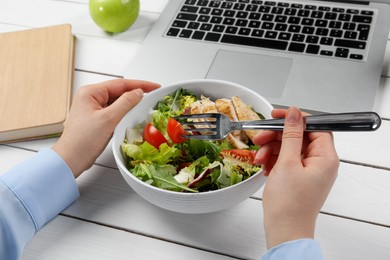Photo of Office employee having business lunch at workplace, closeup