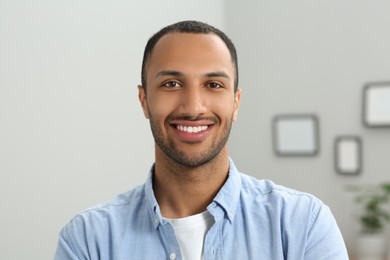 Photo of Portrait of handsome young man at home