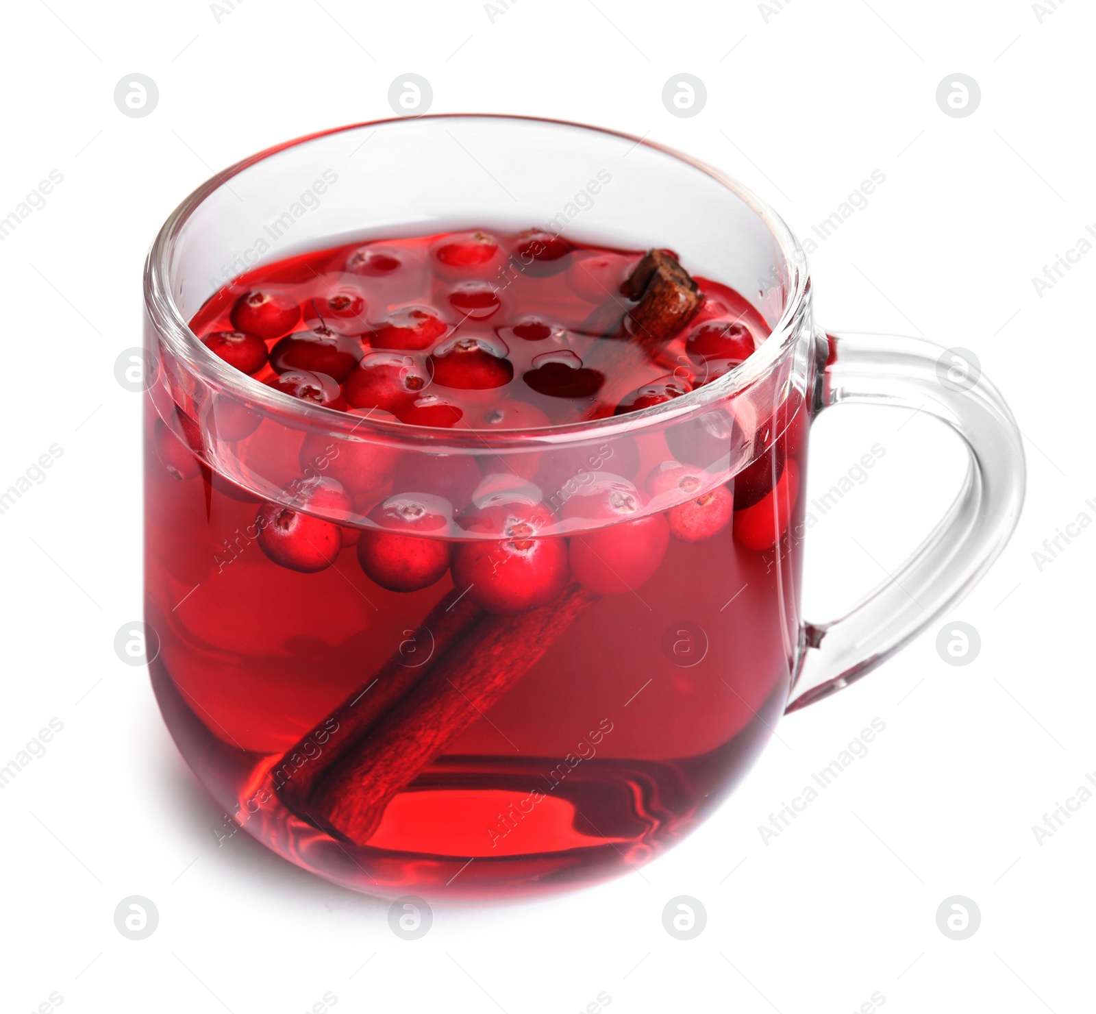 Photo of Tasty hot cranberry tea with cinnamon in glass cup on white background