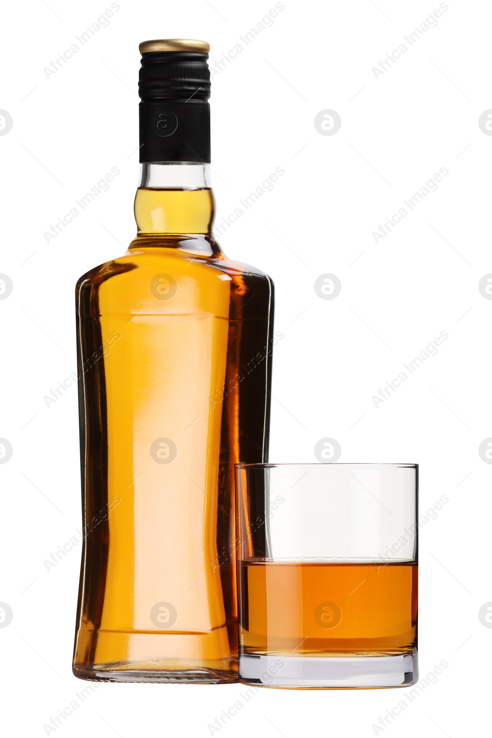 Photo of Glass and bottle of whiskey isolated on white