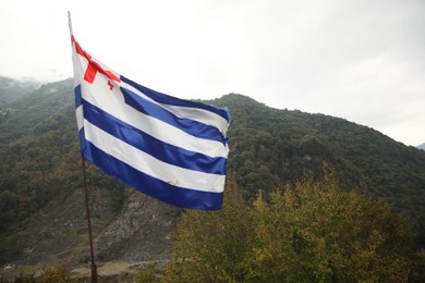 Photo of Adjara, Georgia – September 4, 2002: Adjarian flag on Gvara Fortress in mountains