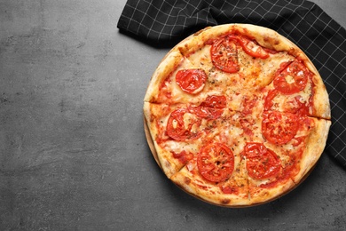 Photo of Hot cheese pizza Margherita on grey background, top view. Space for text