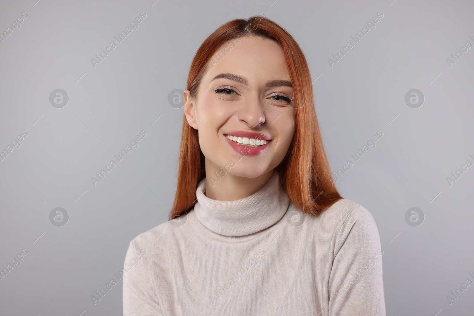 Photo of Portrait of beautiful young woman on light gray background