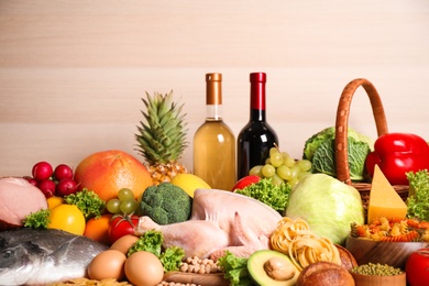 Different products on wooden background, closeup. Healthy food and balanced diet