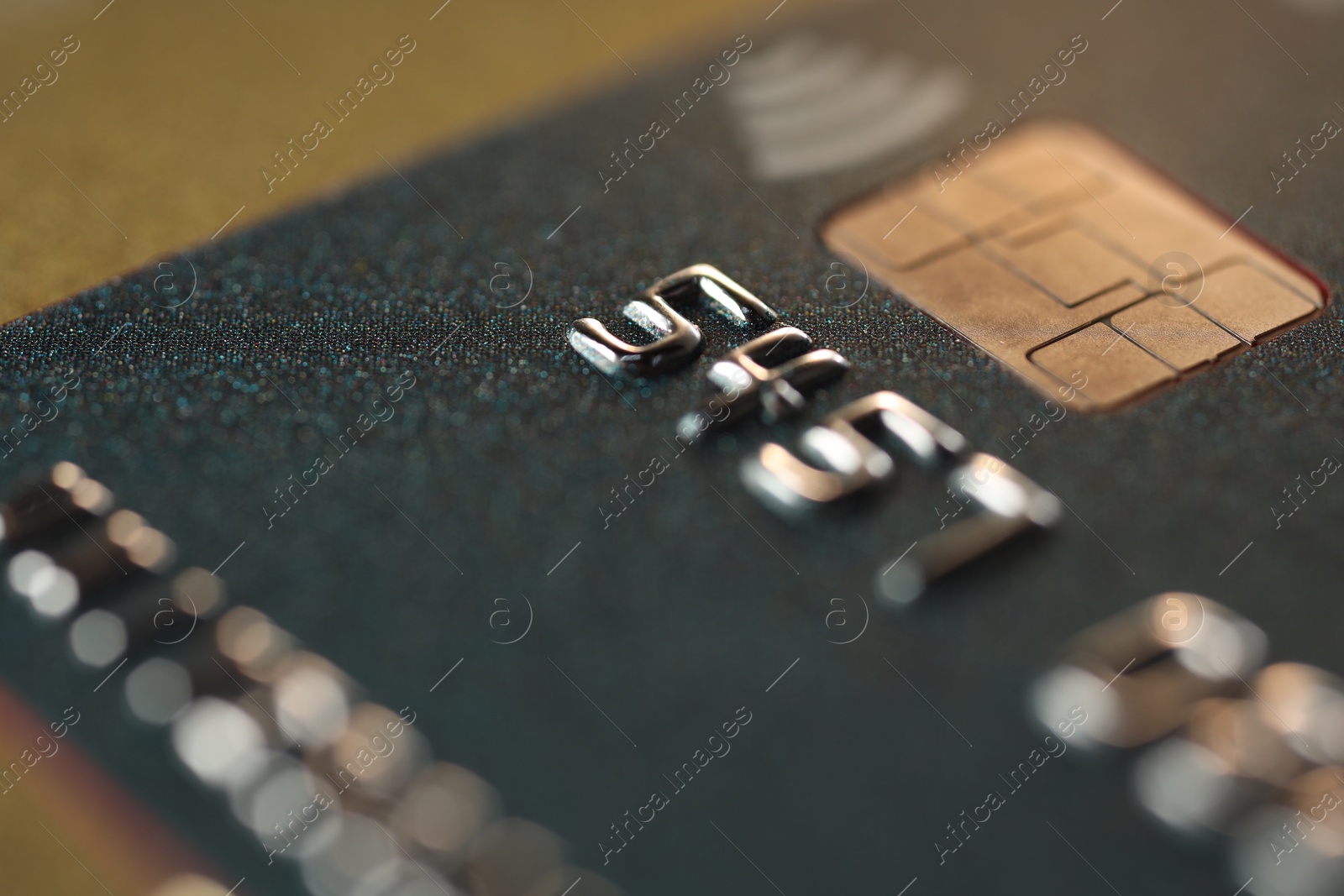 Photo of Plastic credit card on table, macro view