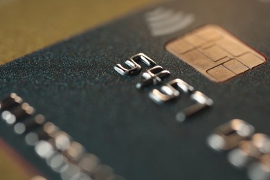 Photo of Plastic credit card on table, macro view