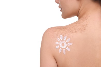 Beautiful young woman with sun protection cream on her back against white background, closeup