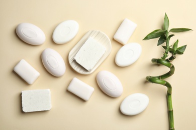 Flat lay composition with soap bars on color background