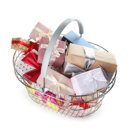 Photo of Shopping basket full of gift boxes on white background