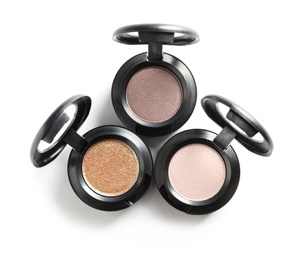 Photo of Different eye shadows on white background, top view. Decorative cosmetics