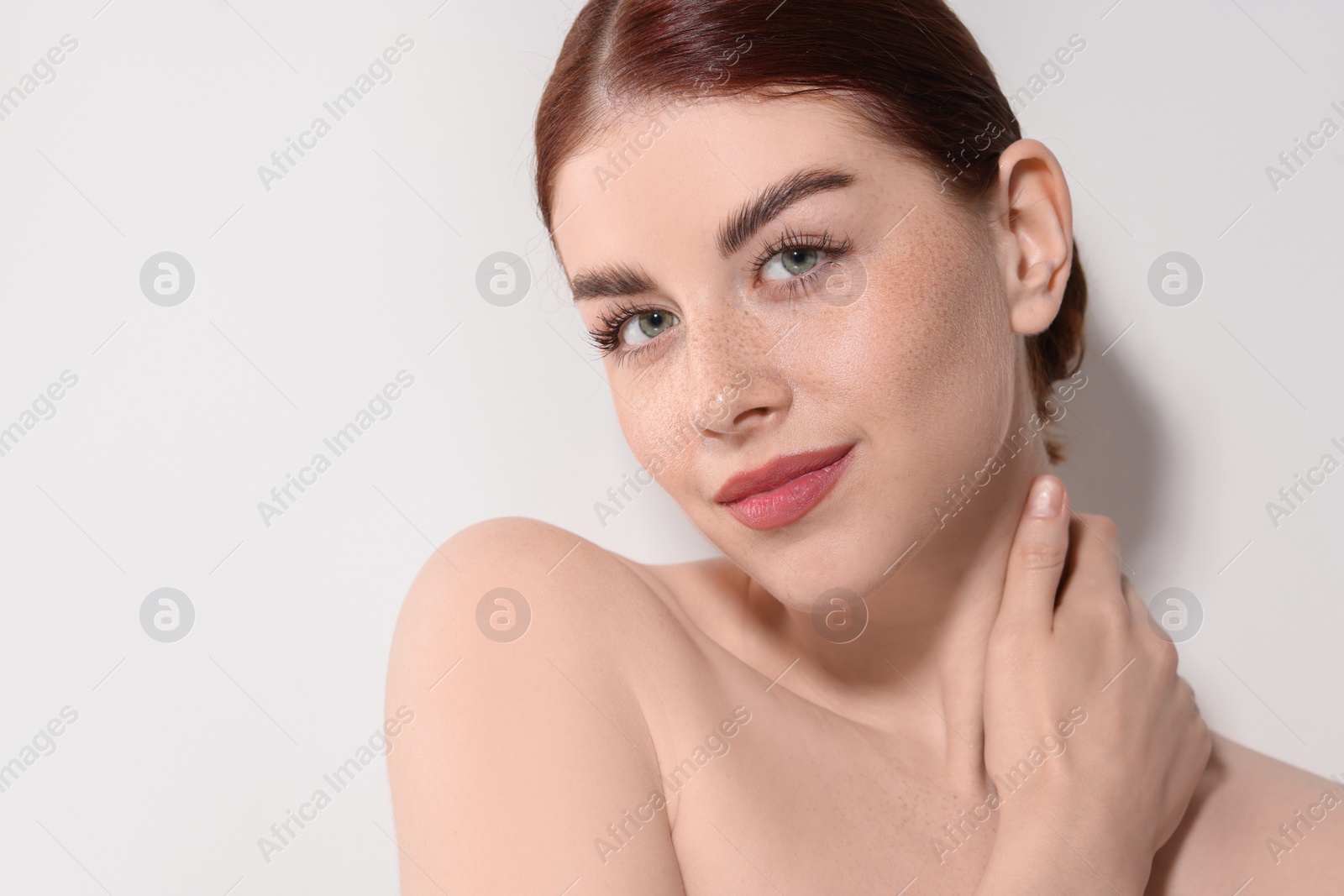 Photo of Portrait of beautiful woman on light background. Space for text