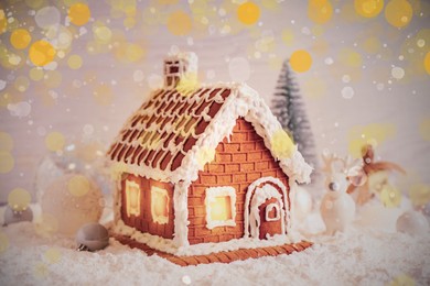 Beautiful gingerbread house decorated with icing on snow