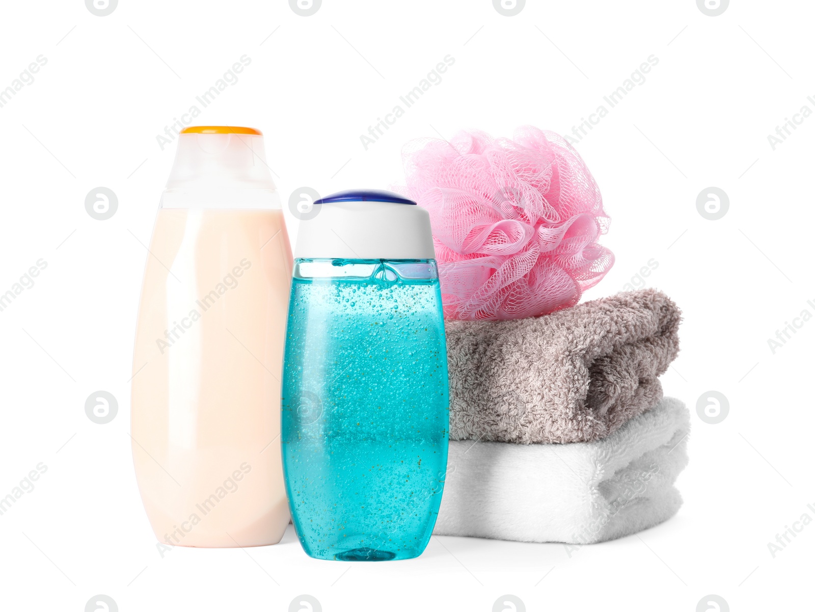 Photo of Personal hygiene products with towels and shower puff on white background