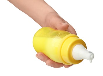 Photo of Woman holding feeding bottle with milk on white background, closeup