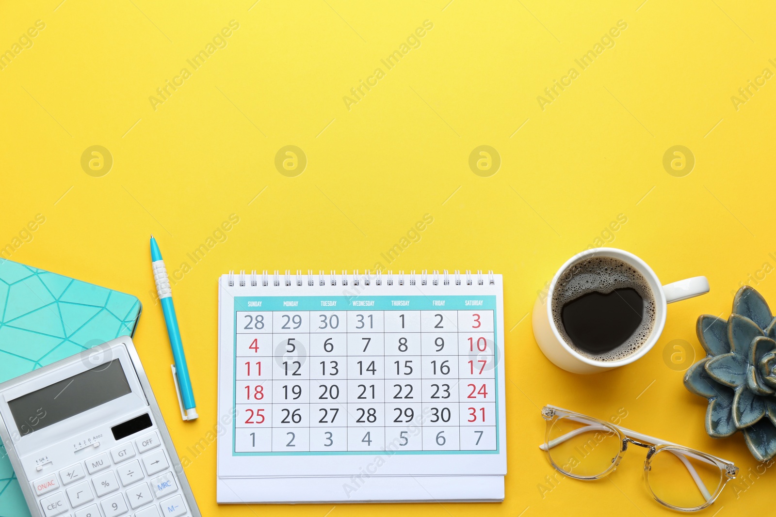 Photo of Flat lay composition with calendar on yellow background