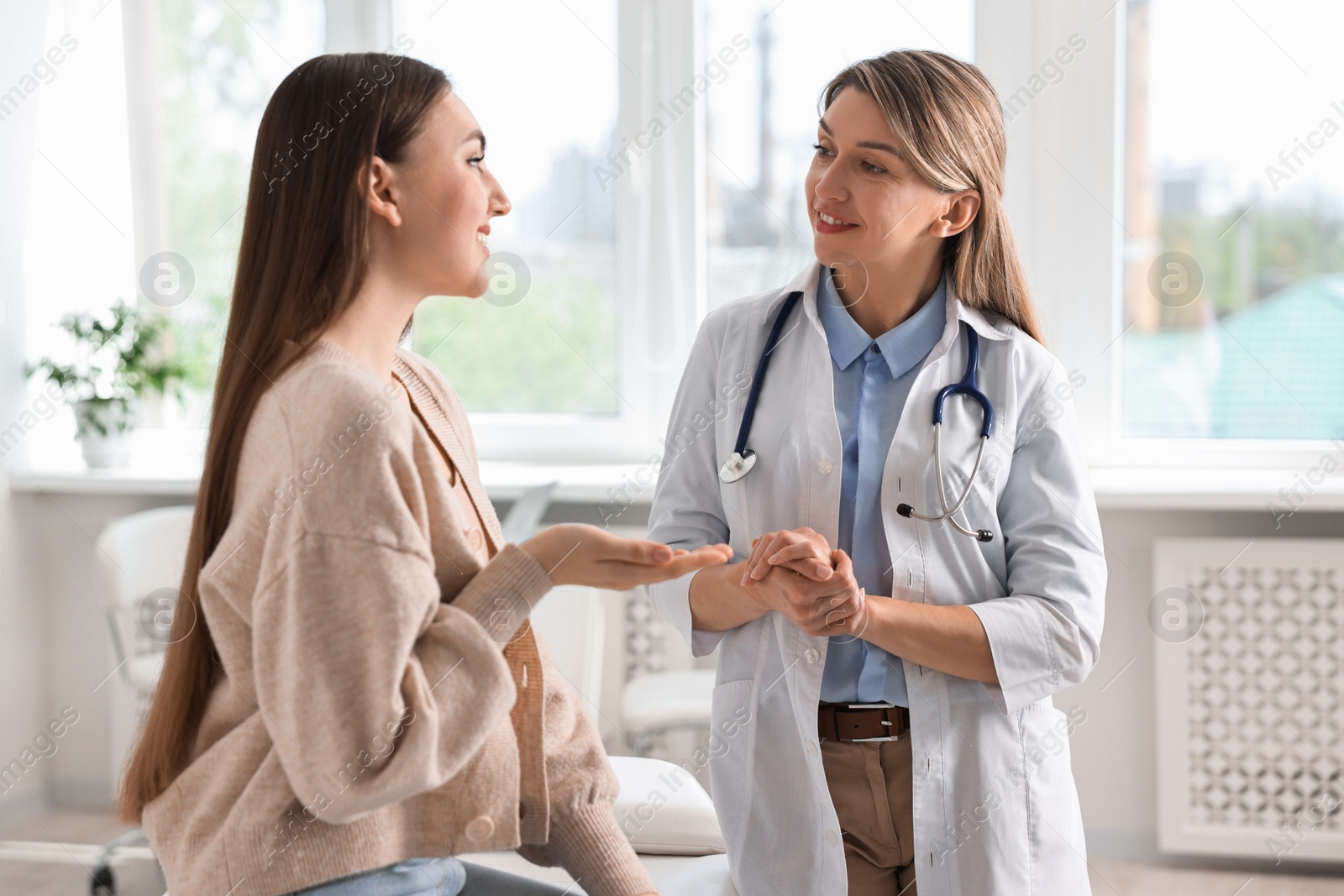 Photo of Professional doctor working with patient in hospital