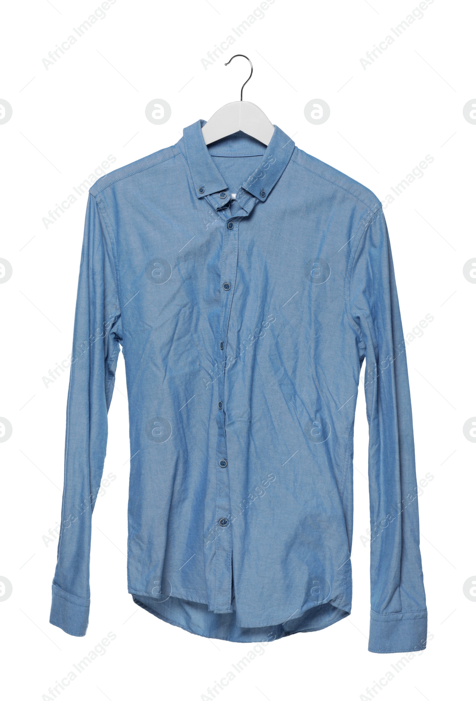 Photo of Crumpled light blue shirt on hanger against white background