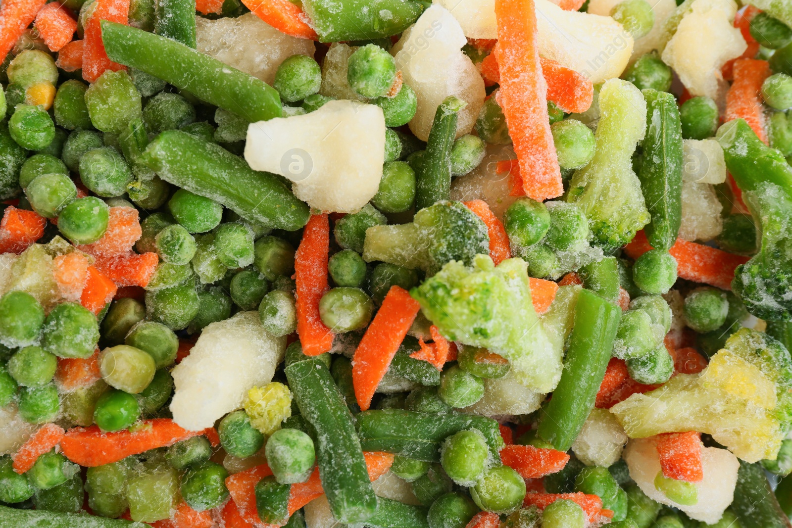 Photo of Different frozen vegetables as background, top view