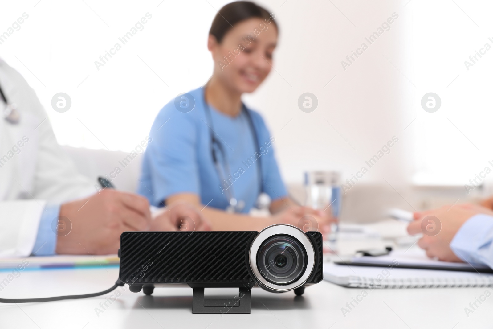 Photo of Video projector on table during medical conference