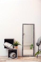 Beautiful room interior with large mirror and shelving unit