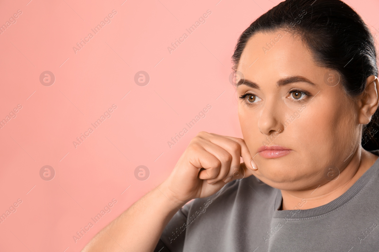 Photo of Woman with double chin on pink background. Space for text