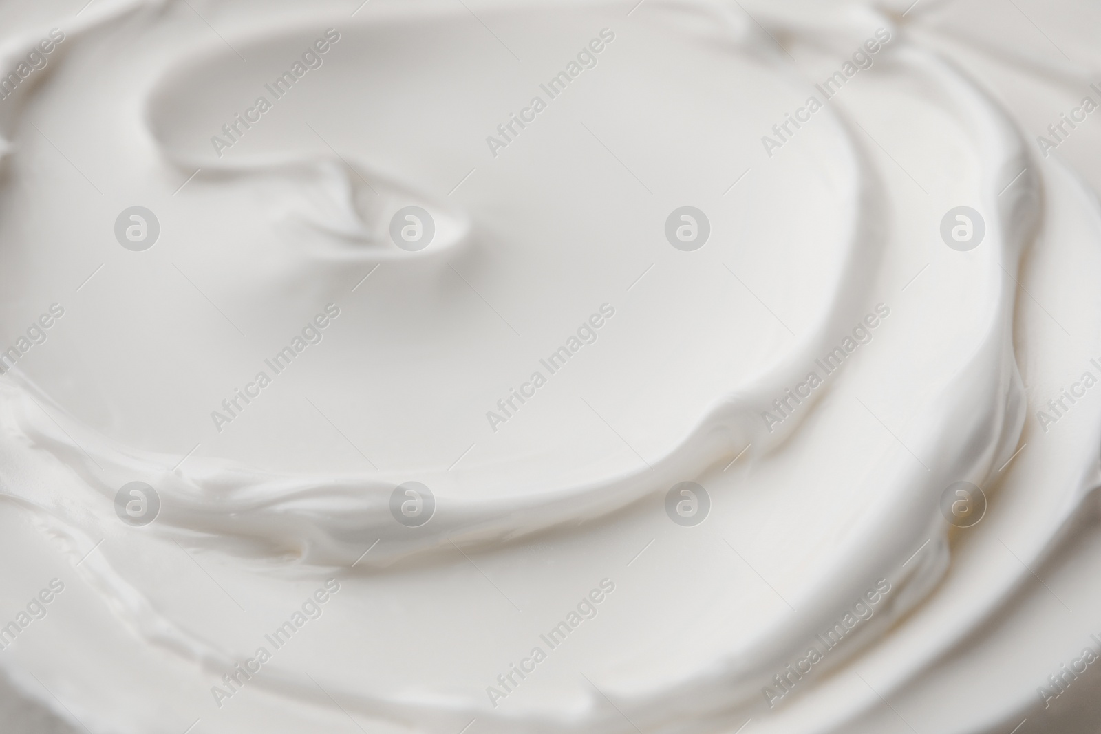 Photo of Texture of white face cream as background, closeup