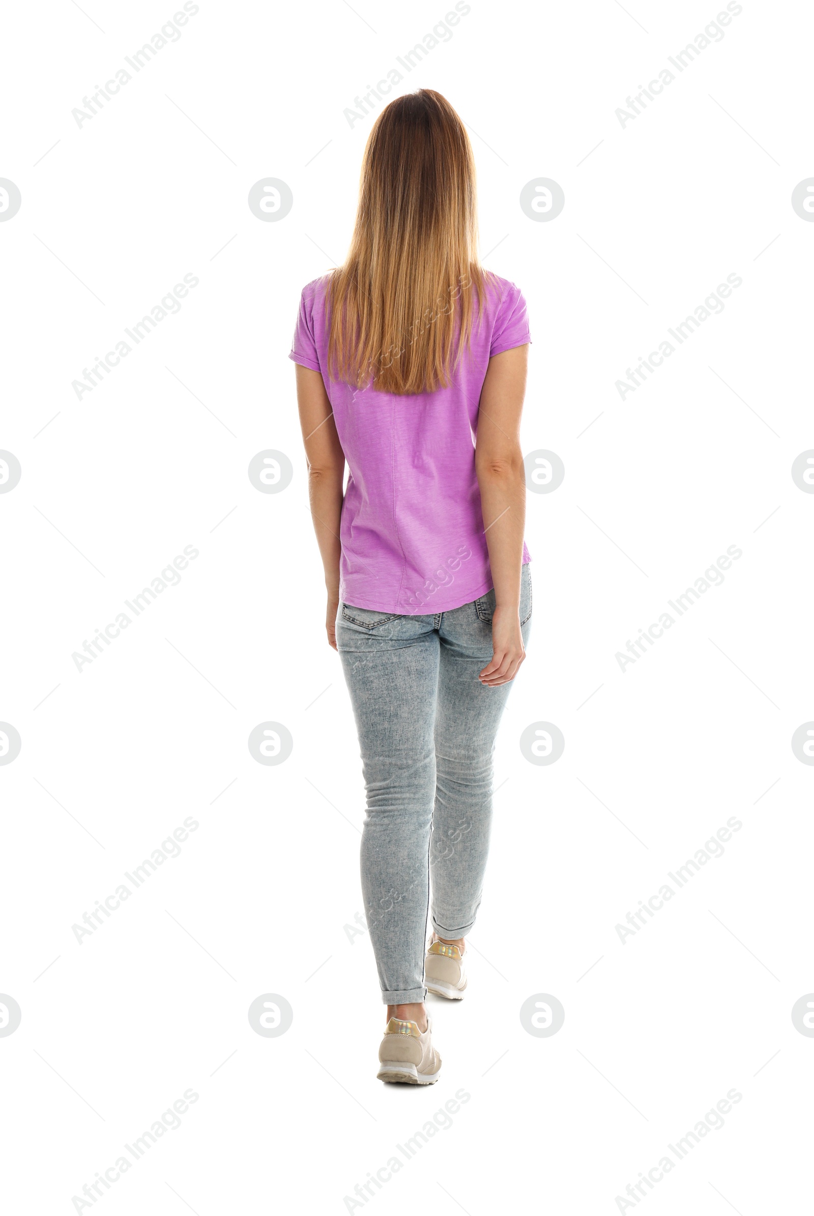 Photo of Young woman posing on white background, back view