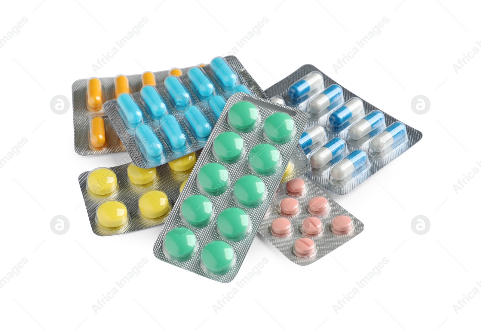 Photo of Pile of different pills in blister packs on white background