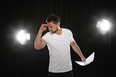 Photo of Professional actor rehearsing on stage in theatre