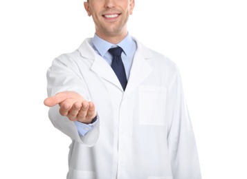 Photo of Male dentist holding something on white background