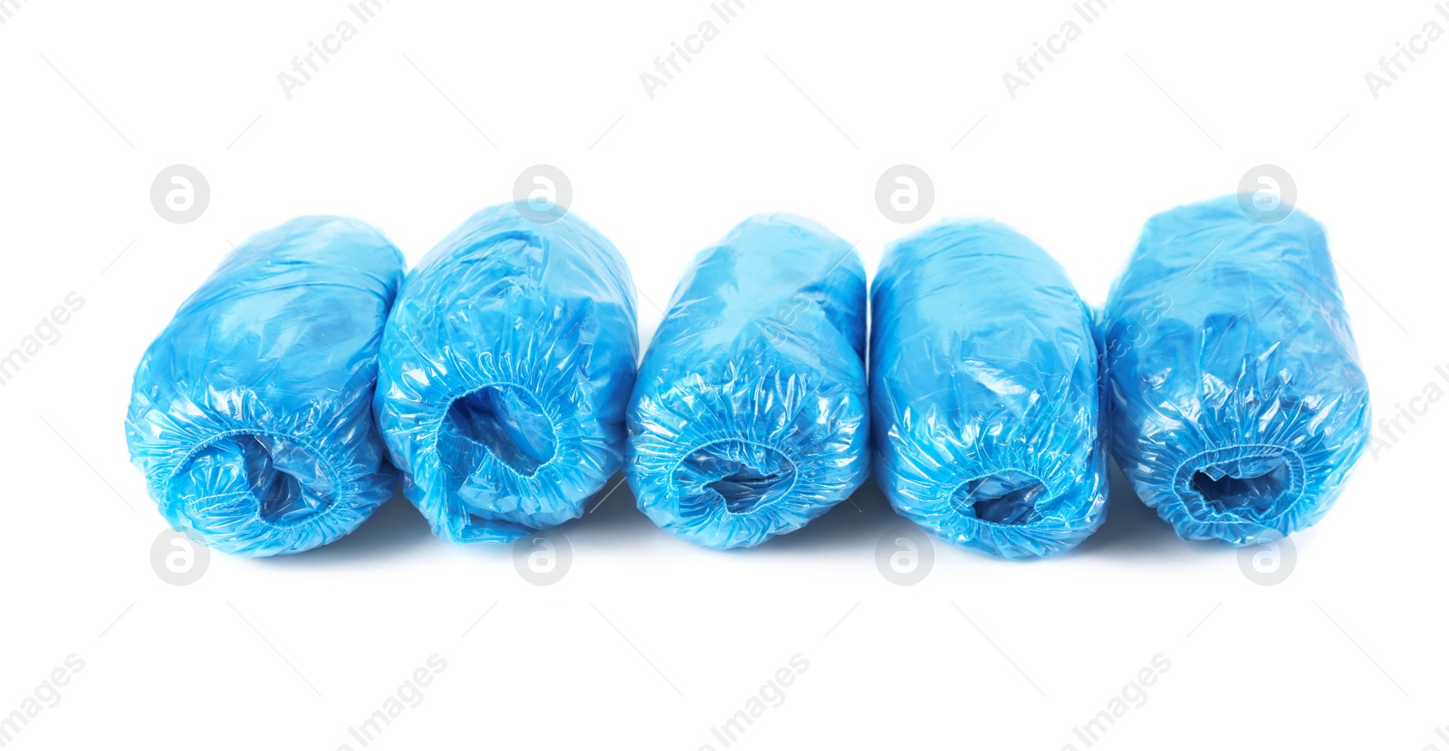 Photo of Medical blue shoe covers on white background