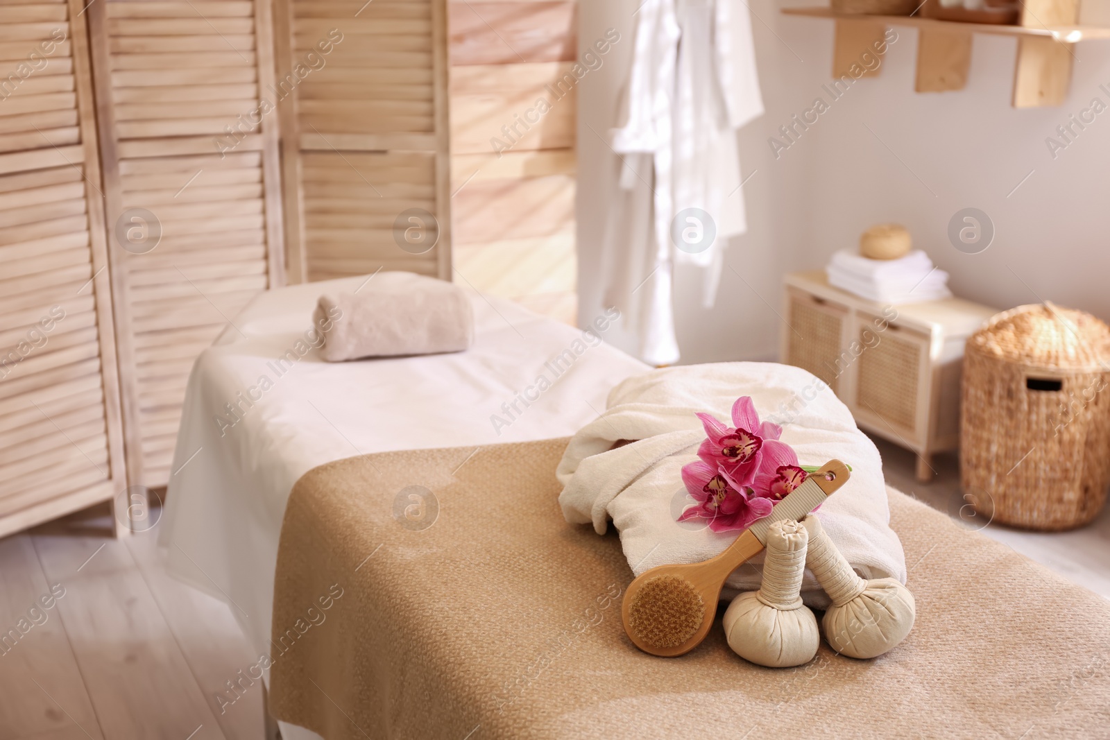 Photo of Beautiful spa accessories in stylish massage room