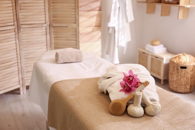 Photo of Beautiful spa accessories in stylish massage room