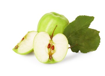 Whole, cut ripe apples and leaves isolated on white