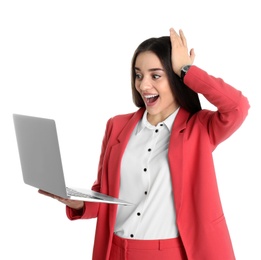 Portrait of excited young woman in office wear with laptop on white background