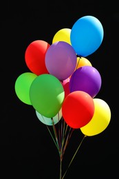 Photo of Bunch of colorful balloons on black background