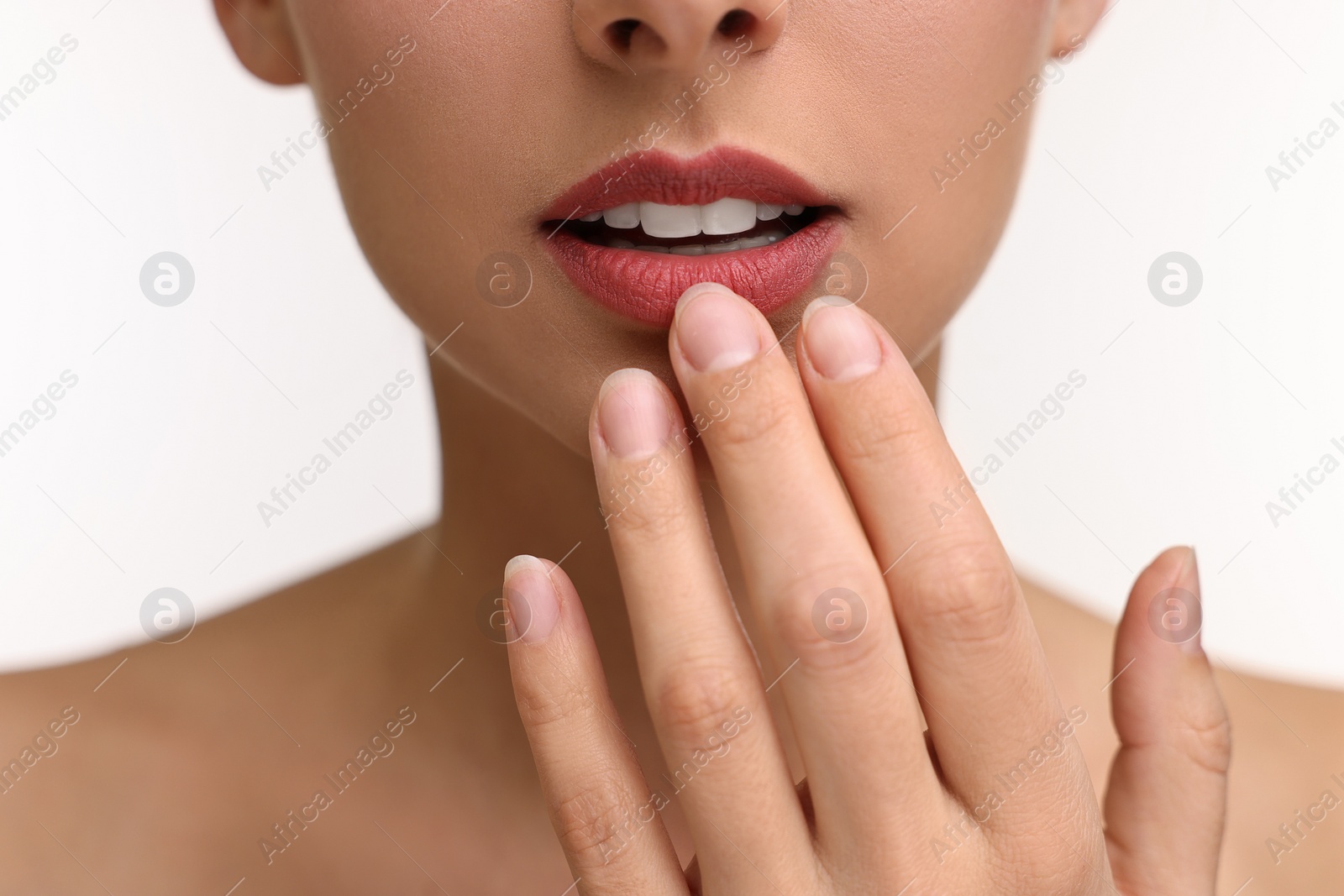 Photo of Woman with beautiful lips on white background, closeup