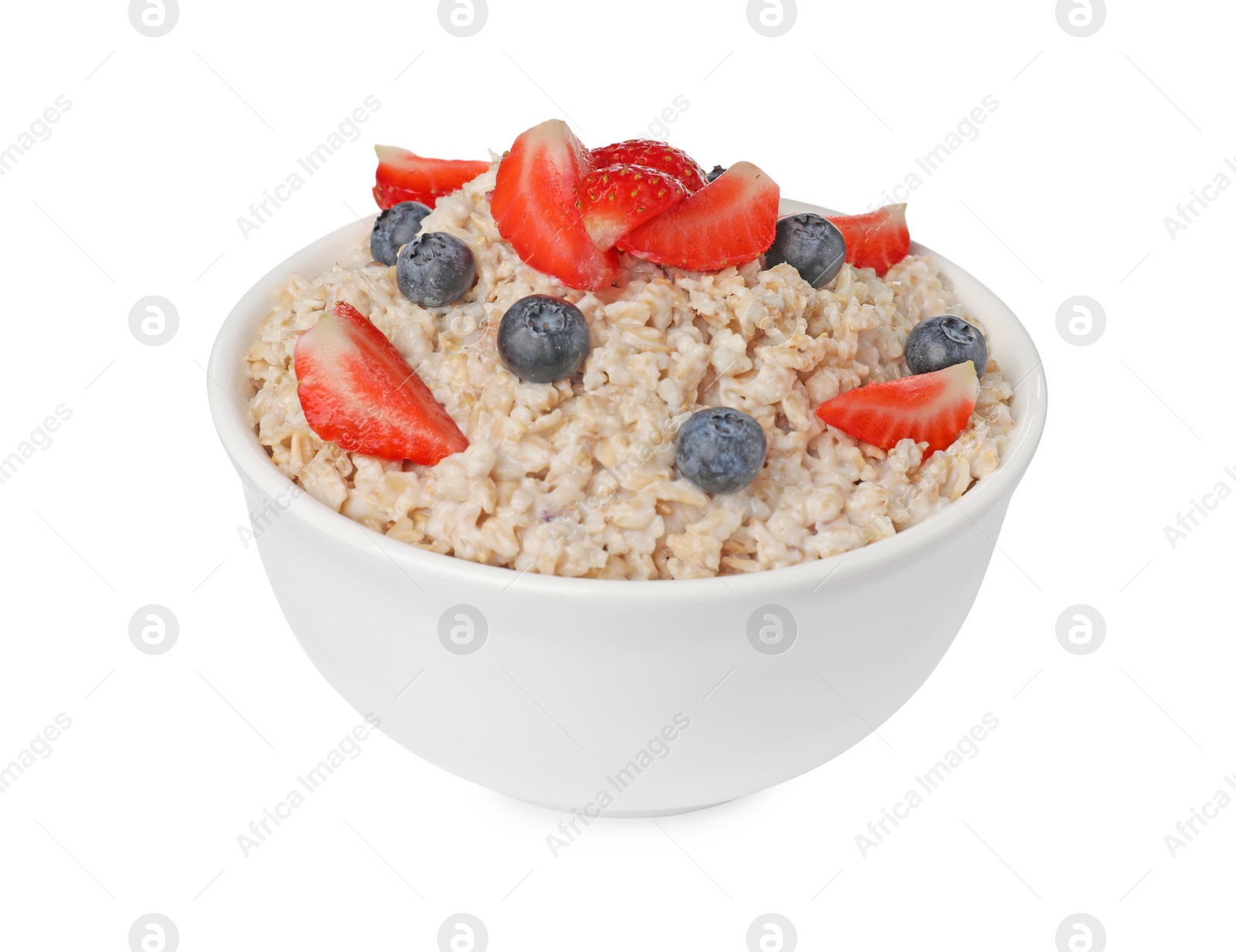 Photo of Tasty boiled oatmeal with berries in bowl isolated on white