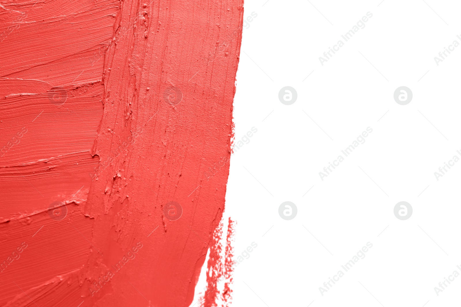 Photo of Red lipstick smears on white background, closeup. Space for text