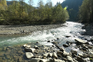 Photo of Mountain river flowing on sunny day. beautiful landscape