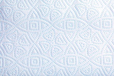 Toilet paper with pattern as background, closeup