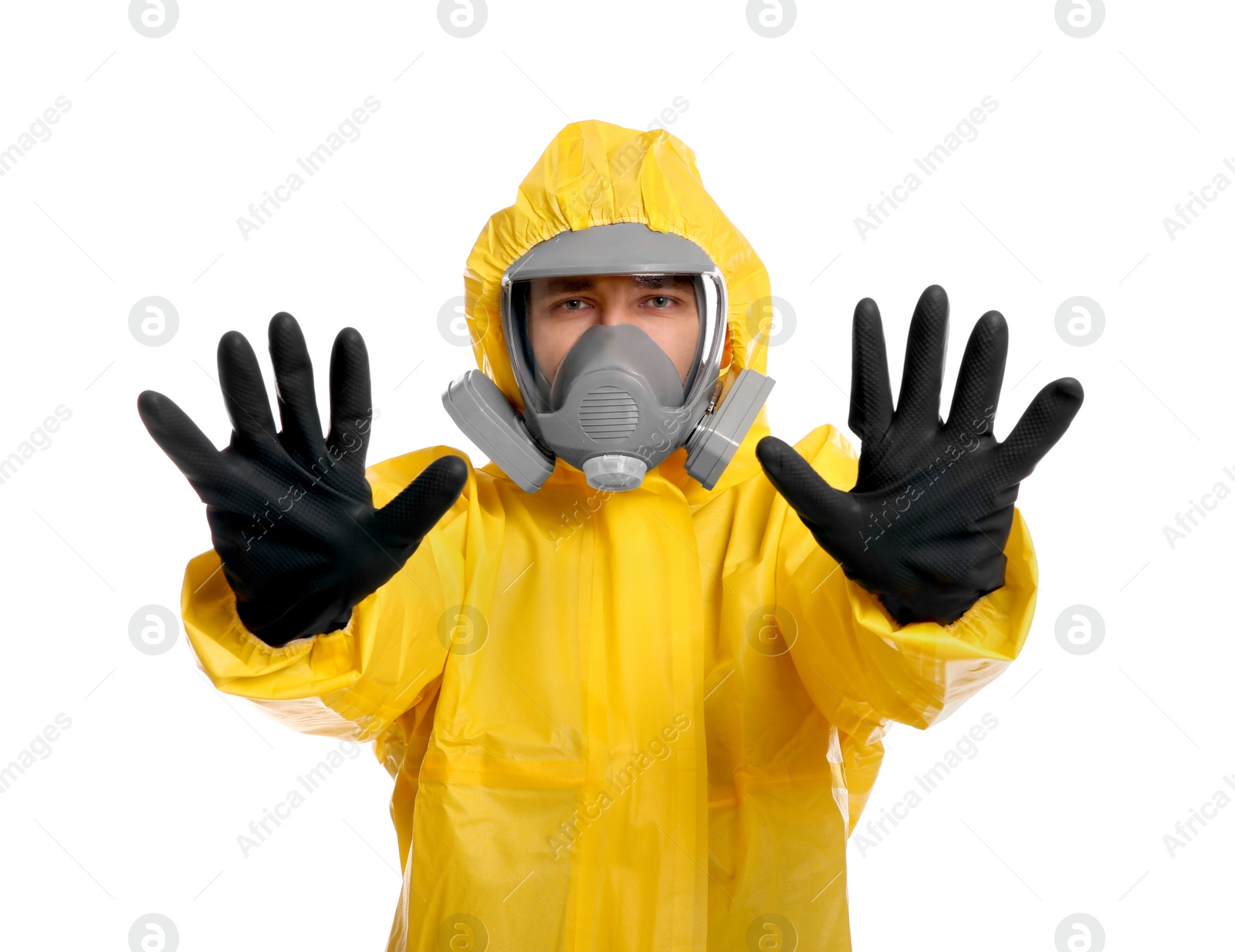 Photo of Man in chemical protective suit making stop gesture on white background. Virus research