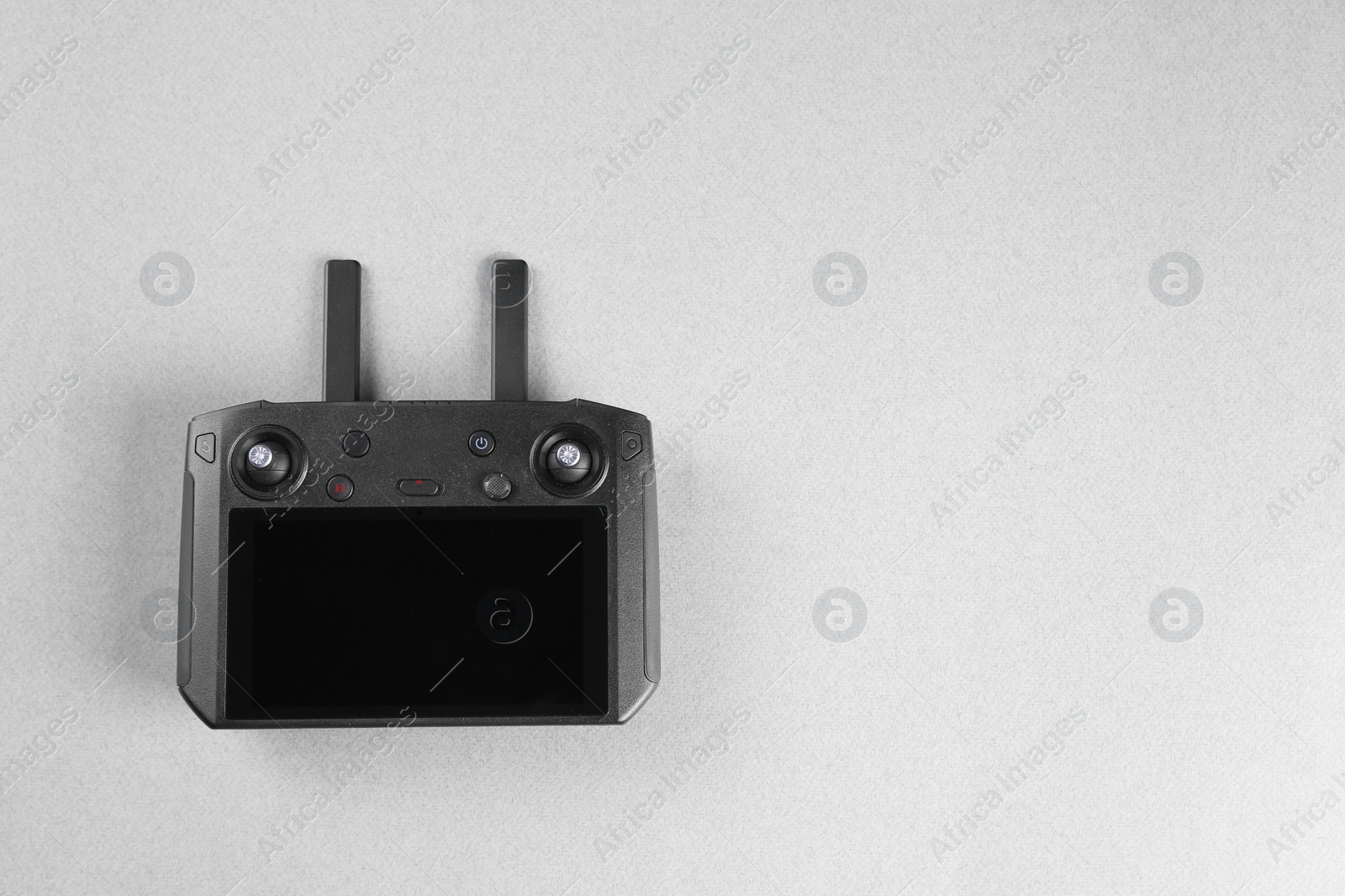 Photo of New modern drone controller on white background, top view