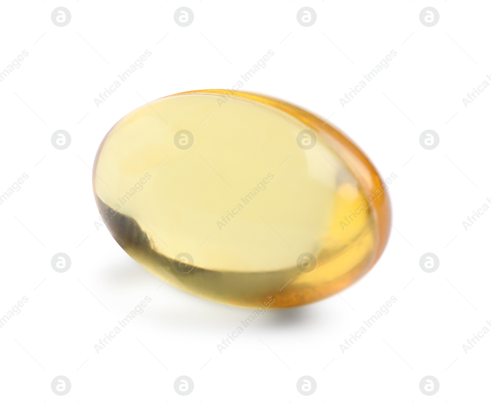 Photo of One yellow pill on white background. Medicinal treatment