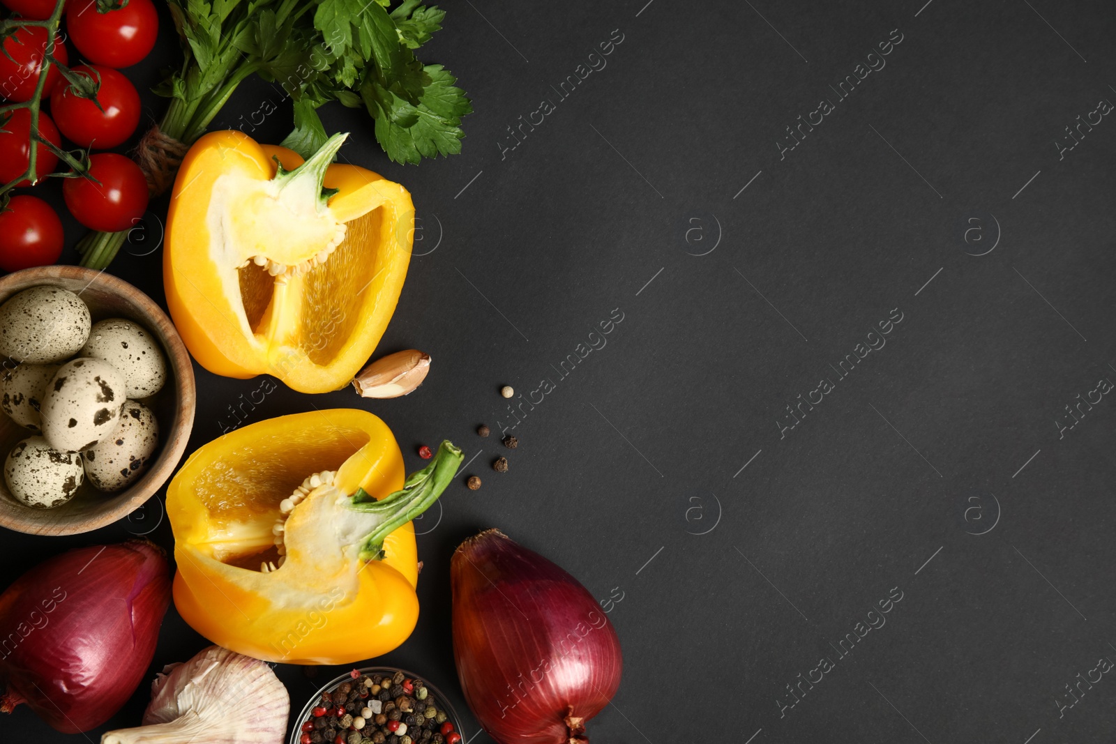 Photo of Flat lay composition with ingredients for cooking on black background. Space for text