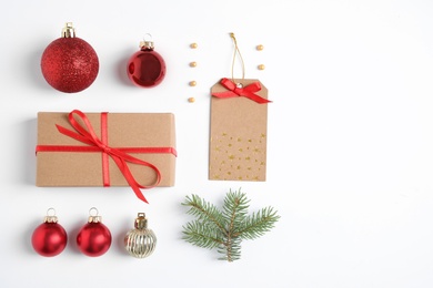 Fir tree branch with Christmas decoration on white background, top view