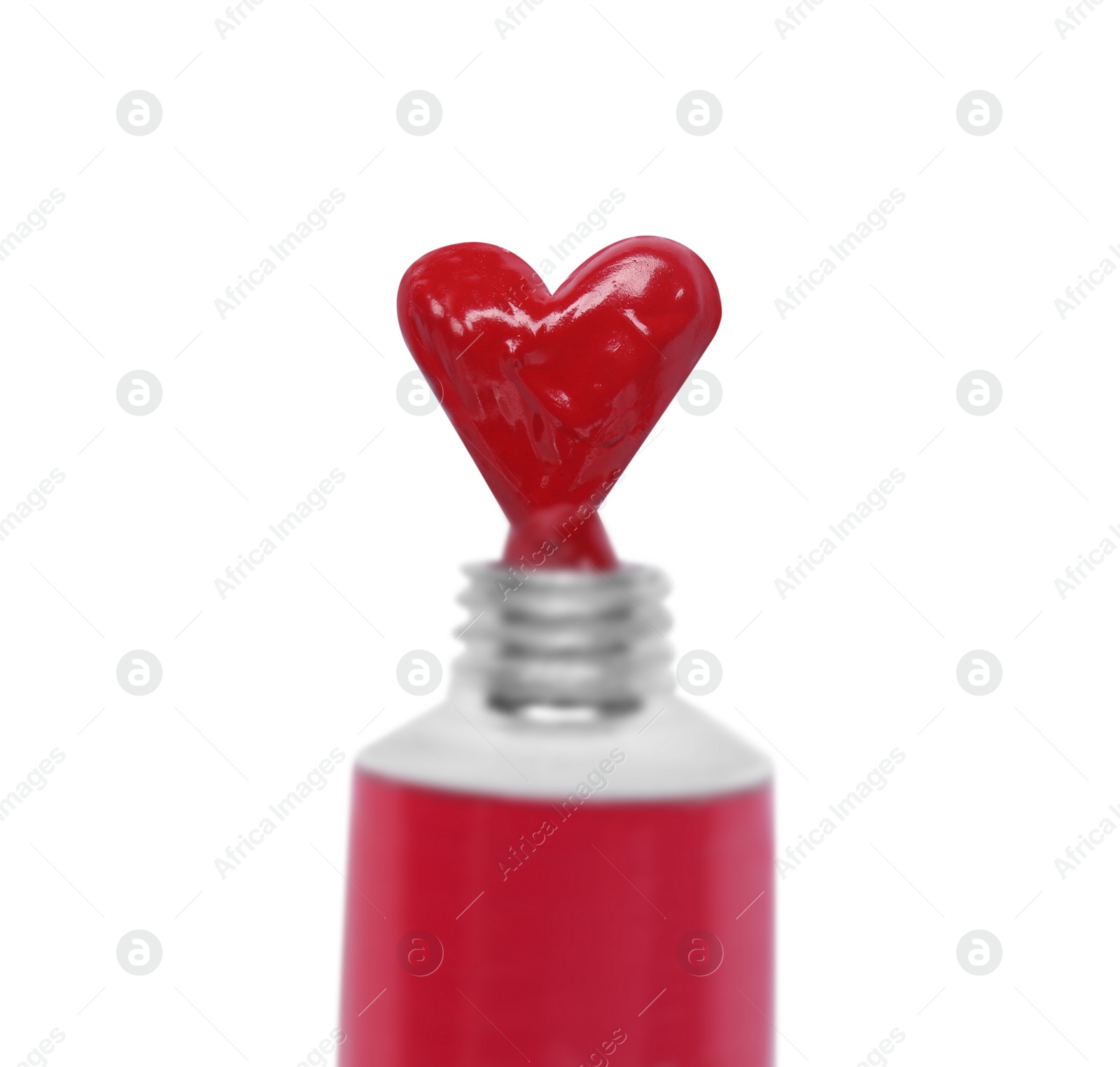 Photo of Red paint squeezed in shape of heart from tube on white background, top view