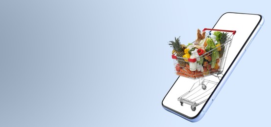 Image of Online purchases. Shopping cart with different products riding out from smartphone on grey background. Banner design with space for text