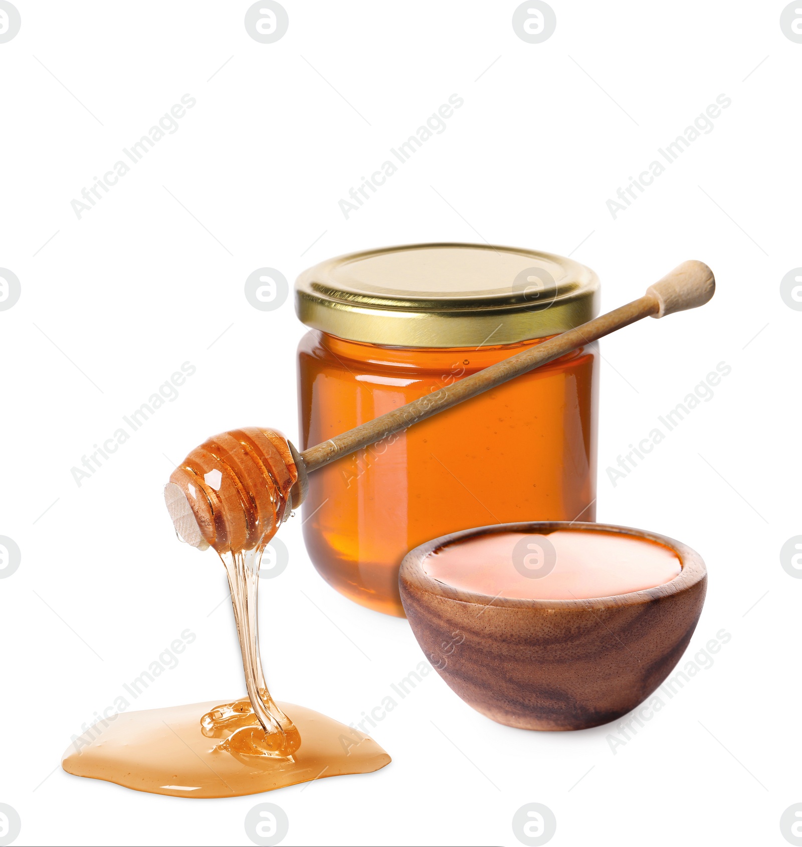 Image of Natural honey dripping from dipper. Jar full of honey and bowl on white background